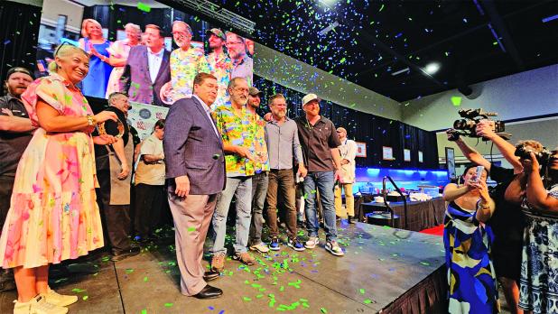 Chef Karlos Knott of the Cajun Saucer in Arnaudville is crowned the 2025 King of Louisiana Seafood at the 18th Annual Louisiana Seafood Cook-Off held June 27 at The Harbor Center in Slidell. Knott is standing to the right of Lt. Gov. Billy Nungesser. (Submitted photo)