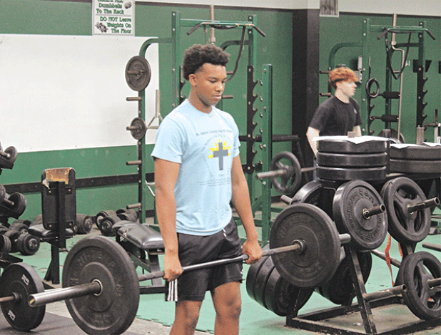 Eunice High football player Caleb Haley participates in a morning workout during the team’s summer strength and conditioning program. Summer strength and conditioning is a vital part of the development of football programs across the state and both Eunice High School and St. Edmund High School take different directions in ensuring their players reach their goals. (Photo by Rhett Manuel)