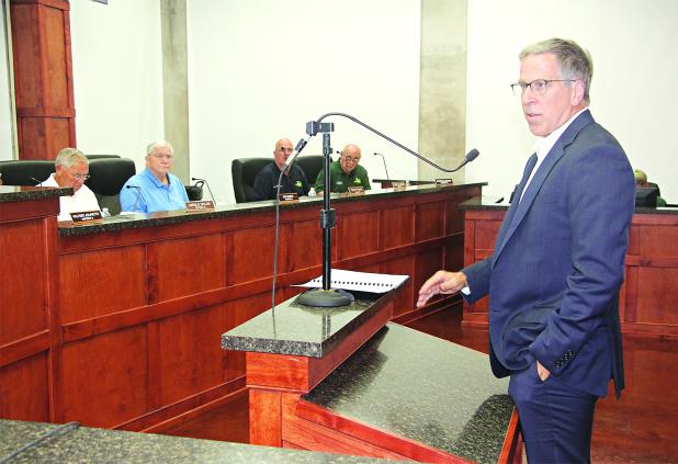 Steve Moosa, right, CPA of Darnall, Sikes and Frederick, presented an audit of St. Landry Parish Government to a meeting of the Parish Council’s Administrative-Finance Committee on Wednesday. The audit is for the 2024 fiscal year that ended Dec. 31, 2024. Seated, from left, are Council members Harold Taylor, Ken Marks, Timmy Lejeune and Ernest Blanchard. (Photo by Harlan Kirgan)
