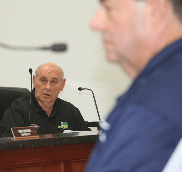 Ernest Blanchard, St. Landry Parish Council member from Eunice, listens to Richard LeBouef, executive director of the St. Landry Parish Solid Waste Commission, speak at Wednesday’s Council meeting. (Photo by Harlan Kirgan)
