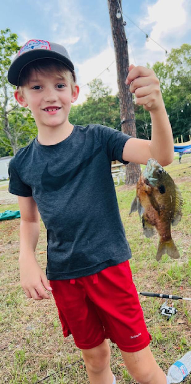Frankie Sanders shows off his catch