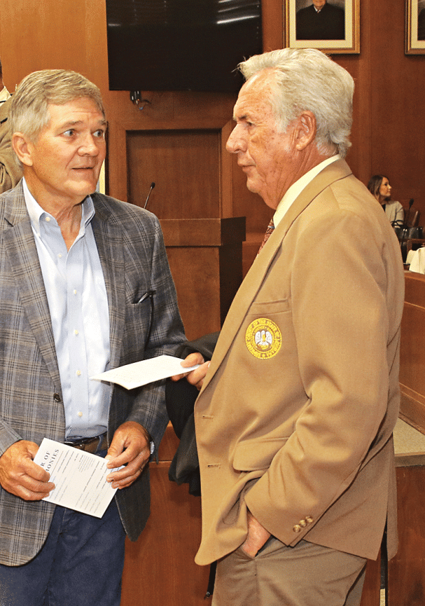 Associate State Supreme Court Justice Jimmy Genovese, right, speaks with Eunice City Judge Terry Hoychick in April.  Genovese administered the oath of office to Laura Garcille as she became a district court judge. (Photo by Harlan Kirgan