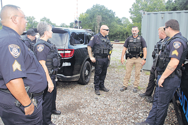Eunice Police officers and a Union Pacific Railroad police officer discuss a railroad crossing safety session on Tuesday morning at the railroad site off La. 13. From left, are Sgt. Sebastien Noel, Officer Chase Godeaux, Officer Corina Schexneider, Lt. Donnie Thibodeaux, Union Pacific Railroad senior special agent Joshua Guillory, Officer Bryan Wiles and Sgt. Trace Tilbury. 