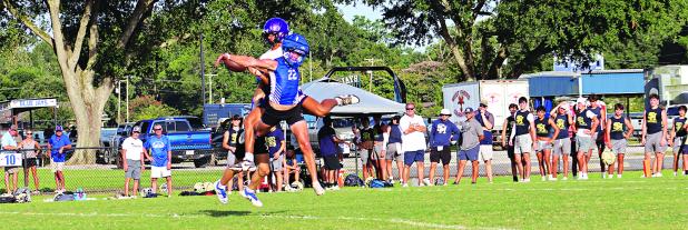 Blue Jay Wyatt Dubois tangles with Opelousas Catholic player during the 7-on-7 game that was part of a 16-team tournament on July 16.   (Photos by Amy Myers)