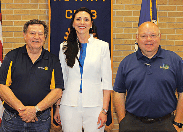 St. Landry Parish Assessor Sherri Zerangue McGovern, center, spoke to the Eunice Rotary Club on Wednesday. With her, from left, are Ellis Daigle, club president, and Van Reed, club secretary. (Photo by Myra Miller)