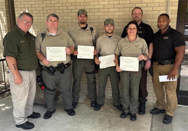 Sheriff Bobby Guidroz announced four corrections deputies have graduated from the State of Louisiana Basic 92-hour course.  During the course, deputies are instructed on the use of force, inmate care, introduction to weapons and contraband control. The St. Landry Parish Sheriff’s Office uses in-house, state certified instructors to train deputies prior to their attending a more extensive corrections academy to become P.O.S.T. – certified corrections officers. Guidroz states, “Our goal is to have every deput