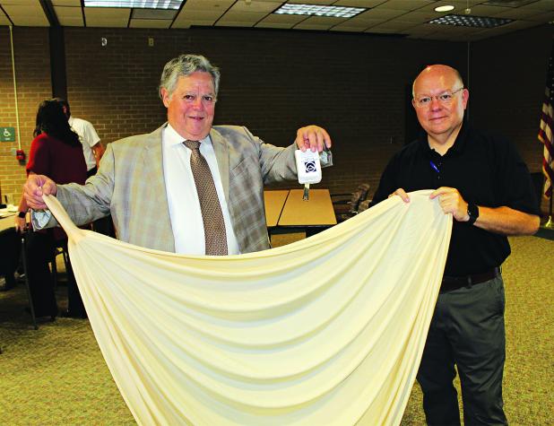 Holding up a radiosonde, a weather instrument, and a weather balloon are John Pucheu and Van Reed. (Photos by Myra Miller)