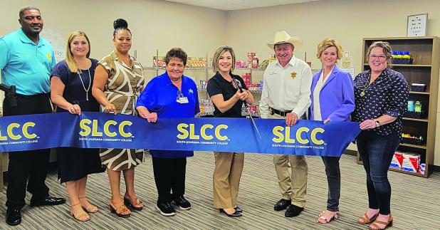 SLLC announces its expansion of its Food Pantry. From left, are Ville Platte Chief of Police Perry Thomas, Brittany Ducote (SLCC), Carleen Jones (SLCC), Mabel Foreman (LHC Group), Lana Fontenot (SLCC), Evangeline Parish Sheriff Charles Guillory, State Representative Rhonda Butler (District 38), and Maggi Bienvenu (One Acadiana) Submitted photo.  