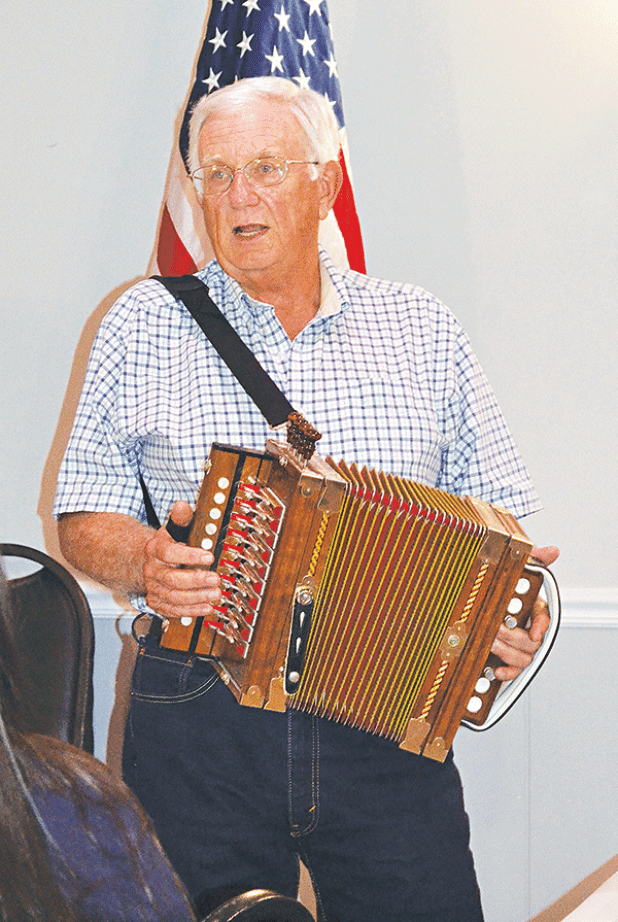 Ken Lyon presented an interesting history of the accordion to the Crowley Lions Club, telling members that the symbol of Cajun French music actually comes from Germany. (Photos by Steve Bandy/Crowley Post-Signal)