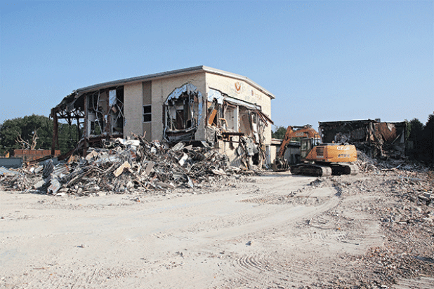 The old Moosa Memorial Hospital continues to disappear as demolition work progresses. St. Landry Parish President Jessie Bellard explained at a Parish Council meeting Wednesday the next big piece of the building to be razed is the two-story section. A building with about 13,000 square feet is to be retained and refurbished for office space, he said. Metal extracted from the building is being sold to recyclers and other material is being  used on parish roads, Bellard said. The cleared property will be aucti