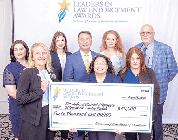 The St. Landry Parish District Attorney’s Office was awarded the statewide “Leaders in Law Enforcement Award” given by the Community Foundation of Acadiana in Lafayette on Tuesday. The District Attorney’s staff includes, back row, from left, are Nancy Soileau, Katie Ryan, Chad Pitre, Alisa Gothreaux and Ricky Leger. Front, from left, are Heather Meyers, Donna Slate and Vickie Lanclos. (Submitted photo)