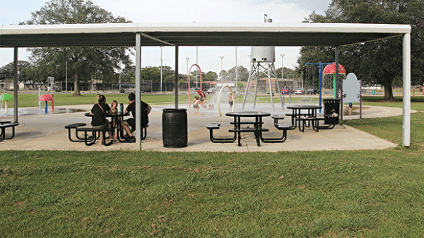 The addition of tables at the splash pad at Fairground Park in Eunice has made enjoying the outdoors easier this year. The area is covered allowing the adults shade and a seating area while the children play in the water. There is another splash pad behind Central Middle School. (Photo by Harlan Kirgan)