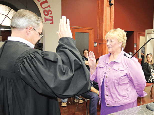 Lynn Lejeune recites the oath of office presented by District Judge Jason Meche at Wednesday’s St Landry Parish Council meeting in Opelousas. Lejeune was voted as interim Council member for District 13 to replace Coby Clavier, who resigned in July (Photo by Harlan Kirgan)