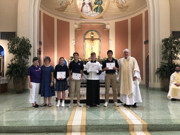 From left, are Lynn Pavich, Regent of Court Eunice 208, Nicole Sonnier, Caroline Lavergne,  John Patrick Fruge, Blake Summerlin, Copeland Miller and the Rev. Hampton Davis. (Submitted photos)