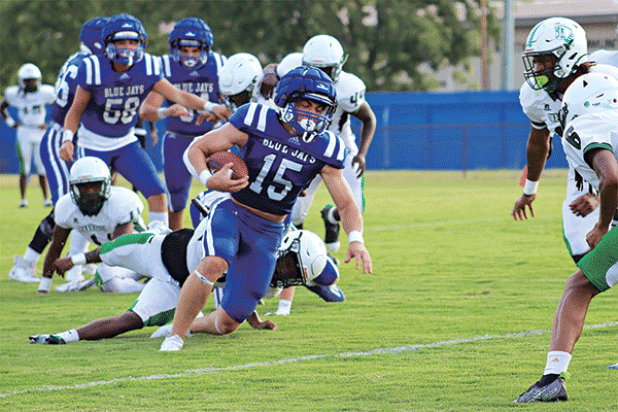 St. Edmund quarterback Kane West runs with the ball during a scrimmage with Peabody on Aug. 22. Football season is starting today and Friday for the Blue Jays and Eunice High Bobcats. Turn to Page 6A for more scrimmage photos and the annual football preview sections in today’s Eunice News. (Photo by Amy Myers)