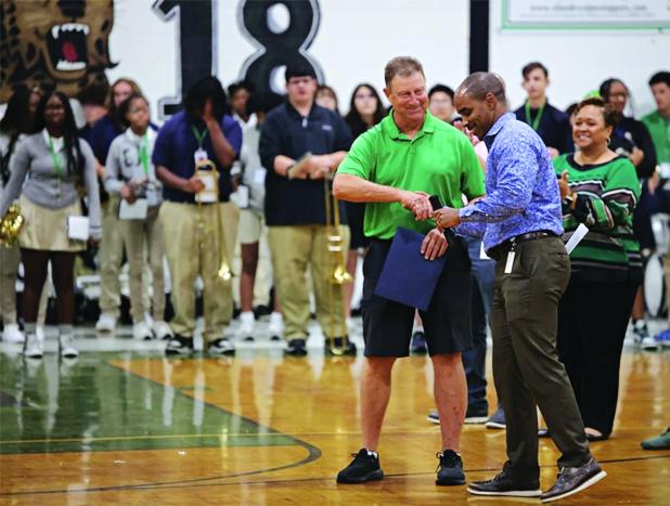 Retired Eunice High coach Paul Trosclair is congratulated by St. Landry Parish Superintendent Milton Batiste III during Monday’s celebration at Eunice High School for his selection to the Louisiana High School Athletic Association Hall of Fame’s Class of 2026. (Photo courtesy of Eunice High School)