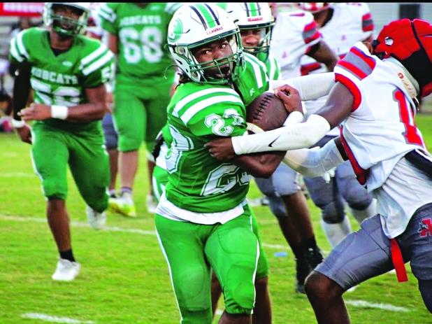 Junior running back Ja’Quan Callaway shakes off a defender and runs for positive yardage in Eunice’s 24-6 win over Abbeville last Thursday in the Acadia-Vermilion Jamboree. (Photos by Rhett Manuel)