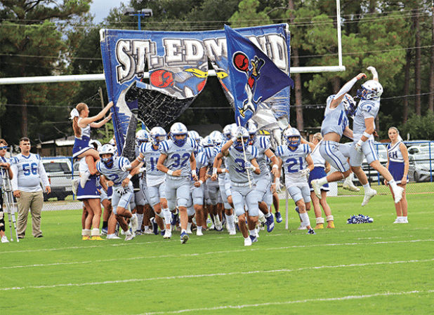 The St. Edmund Blue Jays celebrate the opening of their football season at Friday’s opener of the Joe Nagata Memorial Jamboree. The Blue Jays lost to Catholic of Pointe Coupee 13-12. (Photos by Amy Myers)