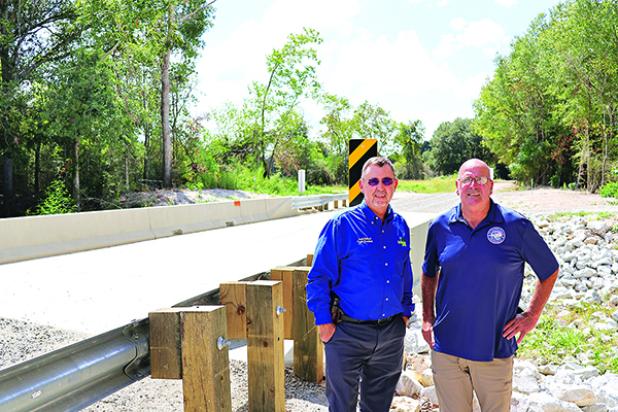 St. Landry Parish Council District 11 representative Timmy Lejeune and Parish President Jessie Bellard are in front of the new bridge on Jessie B Road. (Submitted photo)