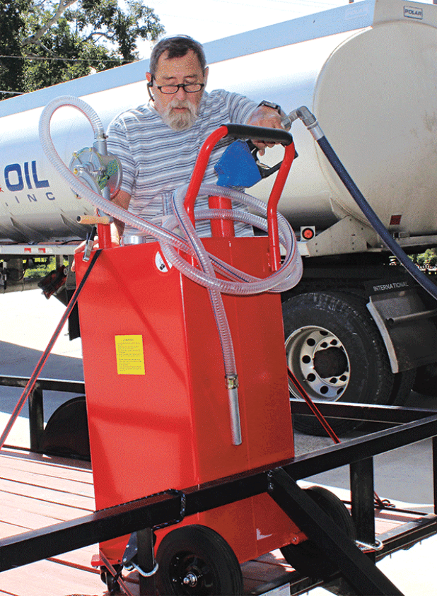 Ricky Melancon of Eunice fills his 35-gallon gasoline container Monday morning for his home generator at Guillory Oil. Melancon has a gasoline generator as well as a propane generator. (Photo by Myra Miller) 