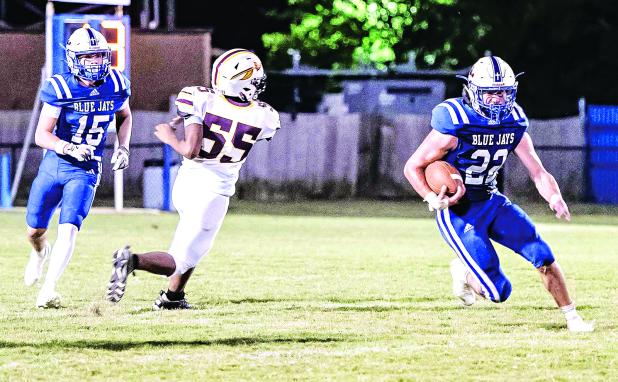 St. Edmund’s Wyatt Dubois, No. 22, ran for four scores in the 58-28 win over Elton on Sept. 5. Also shown at left is Blue Jay Hudson Simon. (Photo by Dwight Jodon)
