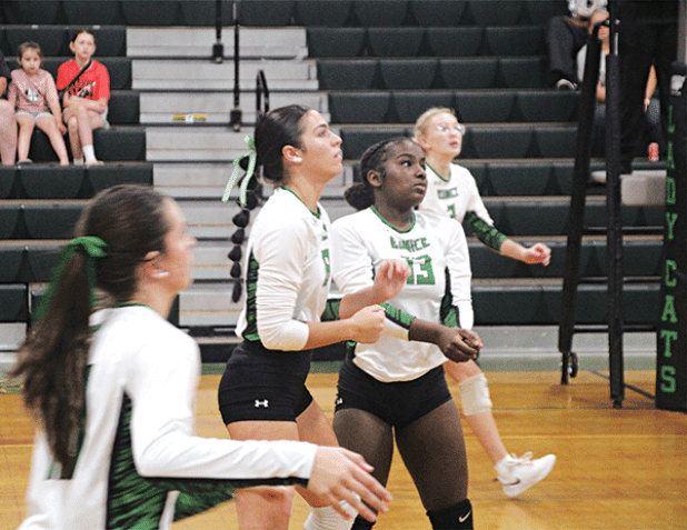 Sophomore setter Cayli Lemelle, in the photo at left, during the Eunice High tournament against Lafayette Renaissance Charter Academy on Sept. 7. Photo at right shows, from left Brooklyn Darbonne, Cayli Lemelle and Ava Grace Brown. The player at left is not identified.. (Photo by Rhett Manuel)