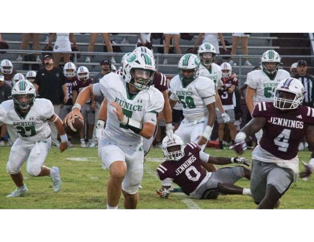 Eunice High School Bobcat’s quarterback Montana Brown makes yardage against the Jennings High Bull dogs Friday evening. The Bobcats lost 22-16 against the Bull dogs. (Photo by Rhett Manuel)