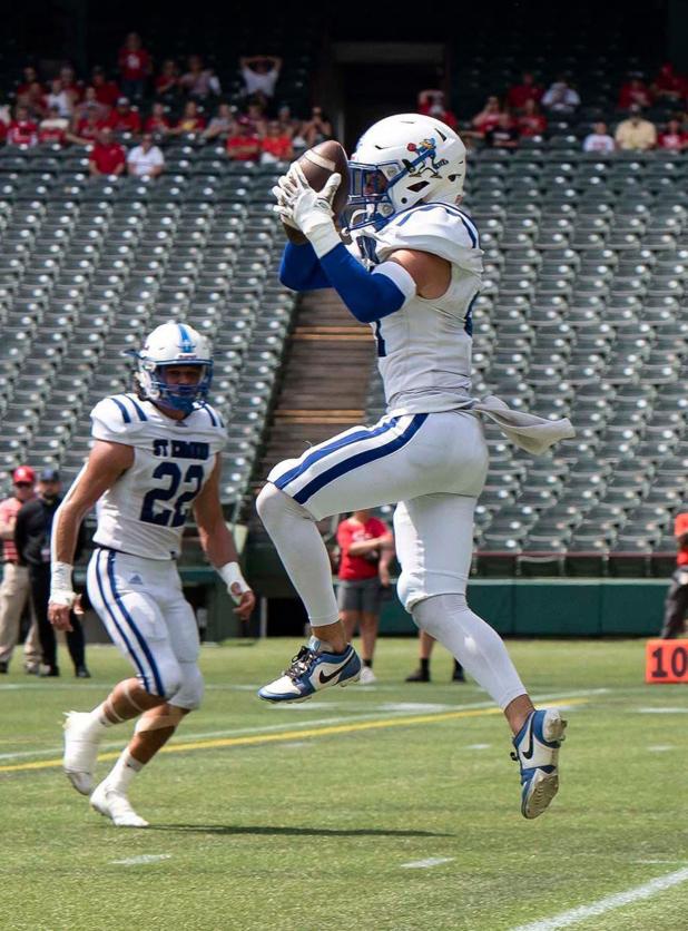 Blue Jay’s safety/kicker Lannie Reed intercepts the ball at the Catholic Bowl in Muenster, Texas. The St. Edmund Blue Jays won 55-6 against Sacred Heart. (Photo by Dwight Jodon)