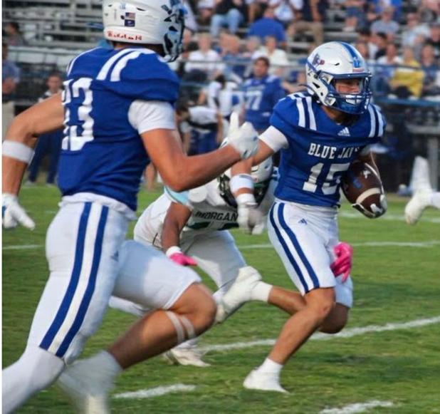 Sophomore wide receiver Hudson Simon runs for a big gain in the Blue Jays’ 60-0 win over Morgan City last Thursday. Simon had 150 yards on four catches. (Photo by Sports Editor Rhett Manuel)