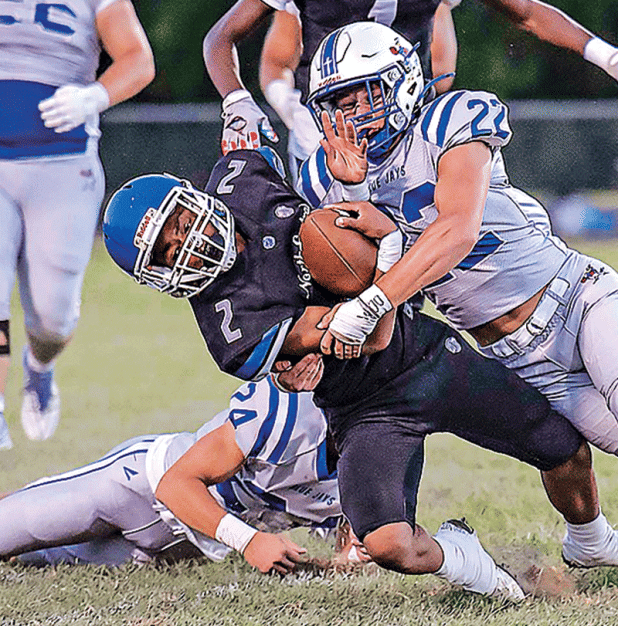 Blue Jay defender brings down a North Central runner. (Photo by Dwight Jodon)