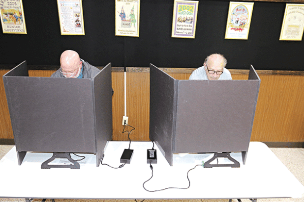 The early voting count for St. Landry Parish as of Thursday was 3,761 with 2,674 votes cast in-person and 1,087 absentee for the Oct. 14 election, according to the Louisiana Secretary of State’s website, geauxvote.com.  Early voting ended on Saturday at the Eunice City Hall and Registrar of Voter’s Office in the courthouse in Opelousas. Marion “Nootsie” Sattler, a Eunice alderman, and Michael Coscino, of Eunice, vote at the Eunice Municipal Complex lobby on Thursday. The election includes candidates for gov