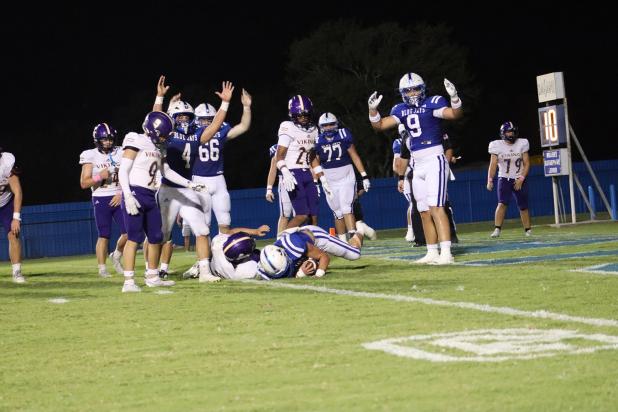 St. Edmund’s Wyatt Dubois, No. 22, wide receiver and safety, scores a touchdown during last Friday’s evening match up against Opelousas Catholic Vikings. (Photo by Amy Myers)