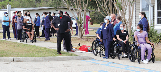 Eunice Manor employees played their part as patients and employees at a drill on  Wednssday. The drill was conducted around a kitchen fire. (Photo by Harlan Kirgan)