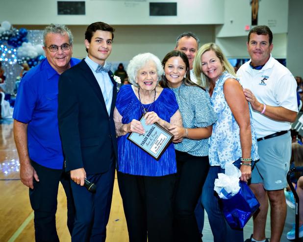 Ann Fruge was named St. Edmund High homecoming parade marshal. She is pictured with her family. From left, are John Fruge, son; John Patrick Fruge, grandson; Fruge; Sarah Fruge, granddaughter; Joel Fruge, son; Kelly Scofield, daughter; and Pat Fruge, son. (Submitted photo) 