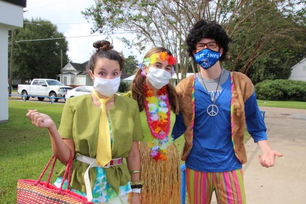 Kailey Miller, a senior, Lauren McGee, freshman, and Alex Ortego, a freshman dress for “Tacky Day” during homecoming week festivities at St. Edmund. (Photos by Myra Miller)