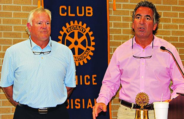 Dwayne Fulton, left, and Clint Bischoff are shown at the Eunice Rotary Club meeting on Wednesday. Fulton spoke about the Falcon Rice Mill in Crowley. Bischoff is a club member. (Photo by Myra Miller)