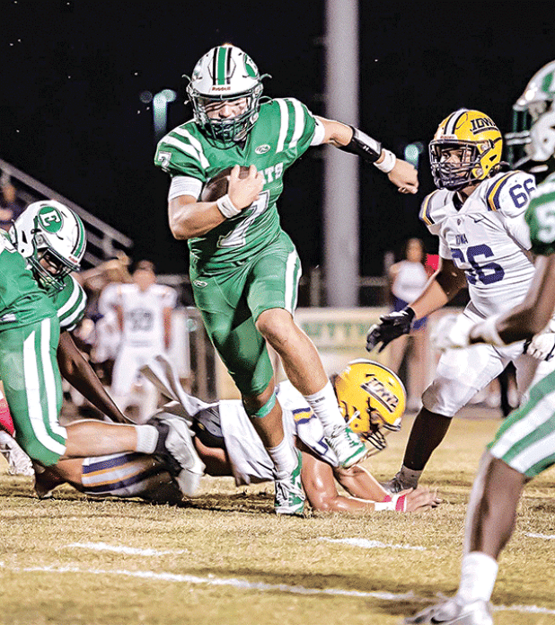 Bobcat quarterback Montana Brown leaps for yards against the Iowa Yellow Jackets in a 48-21 loss on Oct. 25. (Photo by Dwight Jodon)