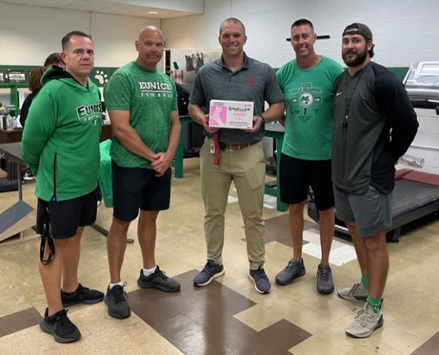 Donation of pink tape from AMC for EHS football players to wear in honor of Breast Cancer Awareness Month.