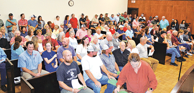 An Acadia Parish courtroom was packed when the Acadia Parish Police Jury held a special meeting to introduce an ordinance to regulate ““sexually oriented businesses” in the unincorporated areas of the parish. The ordinance is in response to a proposed “swingers’ club” between Mowata and Branch. (Photo by Steve Bandy/Crowley Post-Signal)
