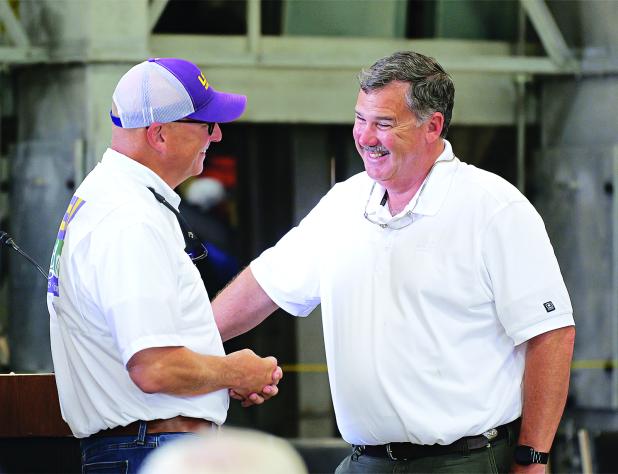 Interim LSU President Matt Lee, left, shares a light moment with Richard Fontenot, president of the Louisiana Farm Bureau Federation, at the AgCenter H. Rouse Caffey Rice Research Station’s 116th annual field day June 24. Photo by Olivia McClure/LSU AgCenter