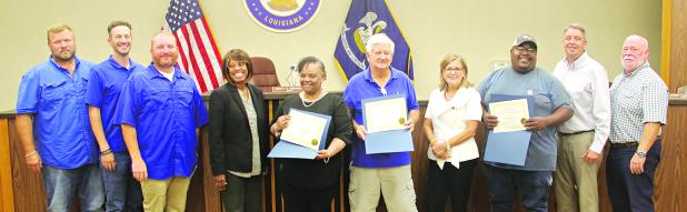 Three volunteers in Eunice were honored during Tuesday’s Mayor and Board of Aldermen meeting. The volunteers are Dorsey Jacobs, Randy Cooper and Debra Guillory. From left, are Stan Feucht, city attorney; Chad Andrepont, alderman; Randall Reed, alderman; Germaine Simpson, alderwoman; Guillory; Cooper; Connie Thibodeaux, alderwoman; Jacobs; Scott Fontenot, mayor; and Marion “Nootsie” Sattler, alderman at-large. 
