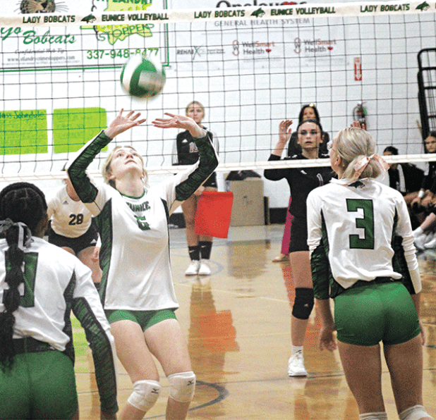 Senior Destiny Labbe sets the ball for junior Ava Grace Brown during Wednesday’s match against Jennings at the Tom Dodge Memorial Jamboree. (Photos by Rhett Manuel)