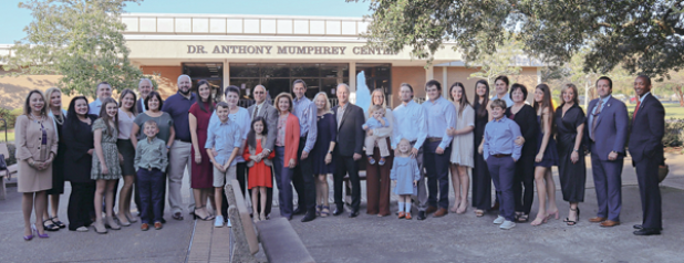 Those attending the ceremony renaming the Acadian Center to the Dr Anthony Mumphry Center at LSUE on Tuesday assembled for a photo. (Photo submitted by LSUE)