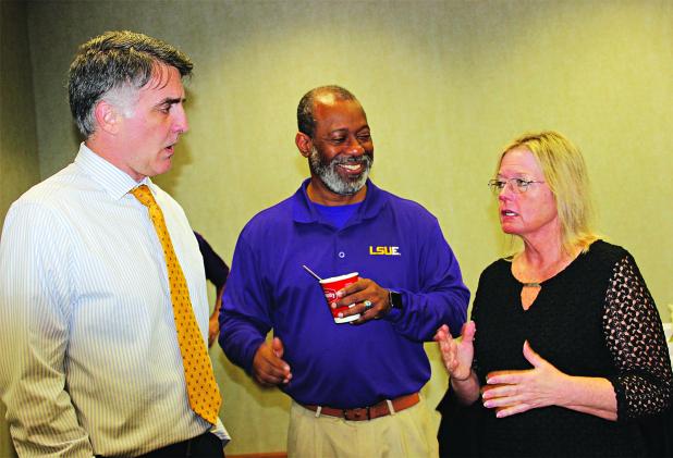 Kelli Bumpus, right, administrative director for graduate medical education with the Edward Via College of Osteopathic Medicine, speaks with LSUE administrators John Hamlin, left, and Chad Jones at Wednesday’s Eunice Rotary Club meeting. Hamlin is vice chancellor for Academic Affairs and Jones is institutional liaison. (Photo by Myra Miller)