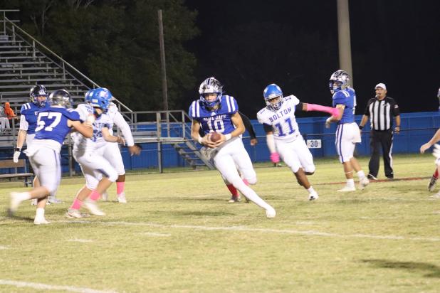 St. Edmund’s quarterback Nathan Zaunbrecher goes for a touchdown during the Blue Jays Homecoming game Friday evening. (Photo by Amy Myers)