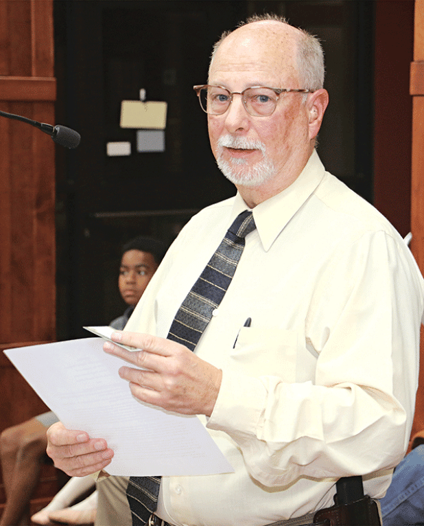 St. Landry Parish Sheriff Maj. Mark LeBlanc, Crime Stoppers coordinator, speaks to the Parish Council on Wednesday about a program to combat littering and dumping. (Photo by Harlan Kirgan)