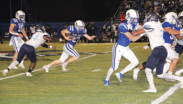 In a familiar sight, St. Edmund running back Henry Summerlin carries the ball for yardage this time against Westminster Christian on Thursday. (Photo by Rhett Manuel)