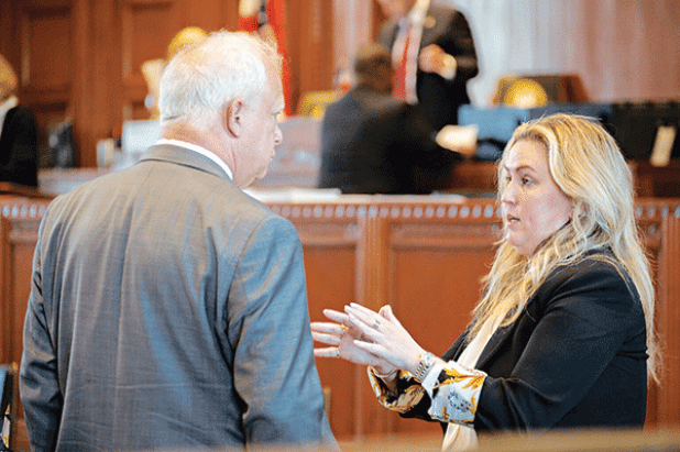 Rep. Julie Emerson, R-Carencro, speaking to Rep. Charles Owen in the House Chamber. (Allison Allsop/ Louisiana Illuminator) 