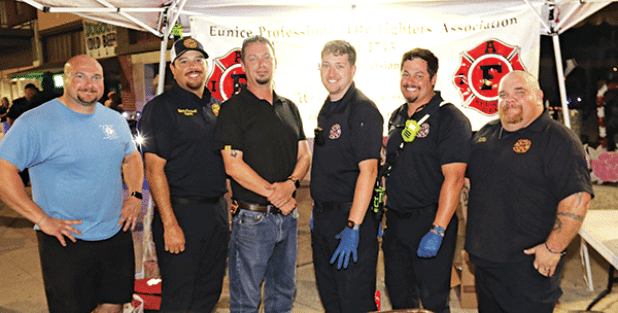 The Eunice firefighters were seen at Eunice’s Fall Back Downtown event Thursday evening. The union held a burgers fund raiser during the event. From left, are Christian Walker, operator; Manny Sandoval, captain; Fire Chief Chaise Brown, Blake Smith, operator; Ben Brown, operator; and Jeremy Faulkner, captain. (Photo by Harlan Kirgan.