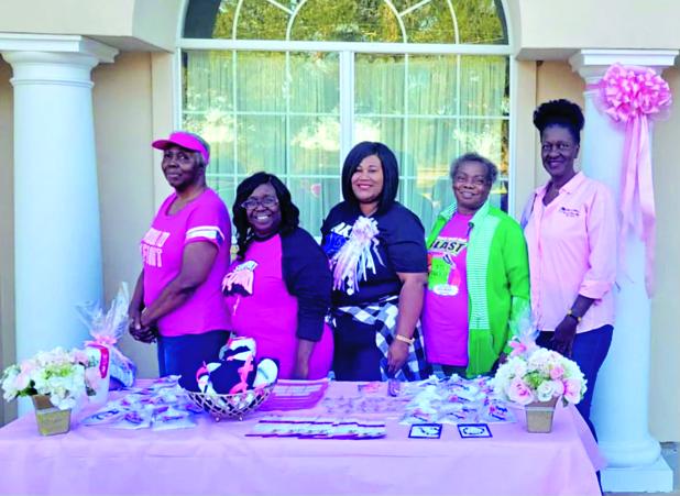 NAUW members attended a Breast Cancer Awareness Walk. From left, are Carolyn Baldwin, Chiquita Thomas, hostess; President Shelsy Williams, Denise Antoine and 2nd Vice President and committee chair person Patricia Harrison.